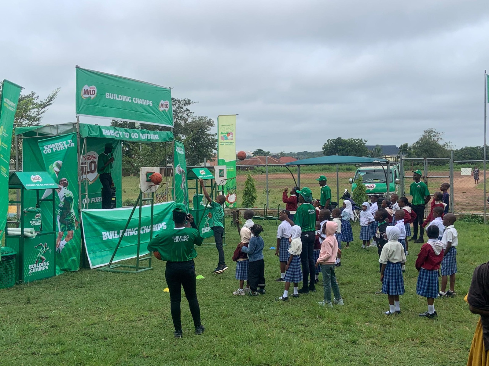 Student taking a shot at Nestlé Milo basketball hoop on NBA grounds